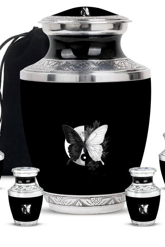 Glossy Black Butterfly Cremation Urn lifestyle display on memorial shelf - contemporary butterfly design with modern artistic flair - memorial set with one large and four small urns
