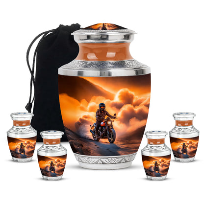 Burnished Gold Bike Cremation Urn lifestyle display on memorial shelf - stylized abstract bike pattern with bold lines - memorial set with one large and four small urns