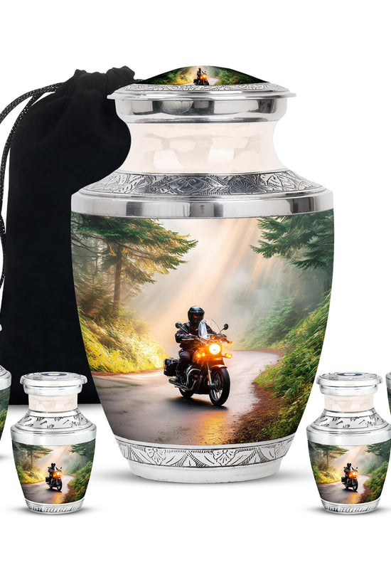 Warm Gold Bike Cremation Urn lifestyle display on memorial shelf - stylized abstract bike pattern with bold lines - memorial set with one large and four small urns