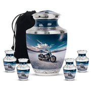 Indigo Bike Cremation Urn lifestyle display on memorial shelf - modern art-inspired bike motif on sleek aluminum - memorial set with one large and four small urns