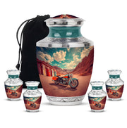 Soft Teal Bike Cremation Urn lifestyle display on memorial shelf - modern art-inspired bike motif on sleek aluminum - memorial set with one large and four small urns
