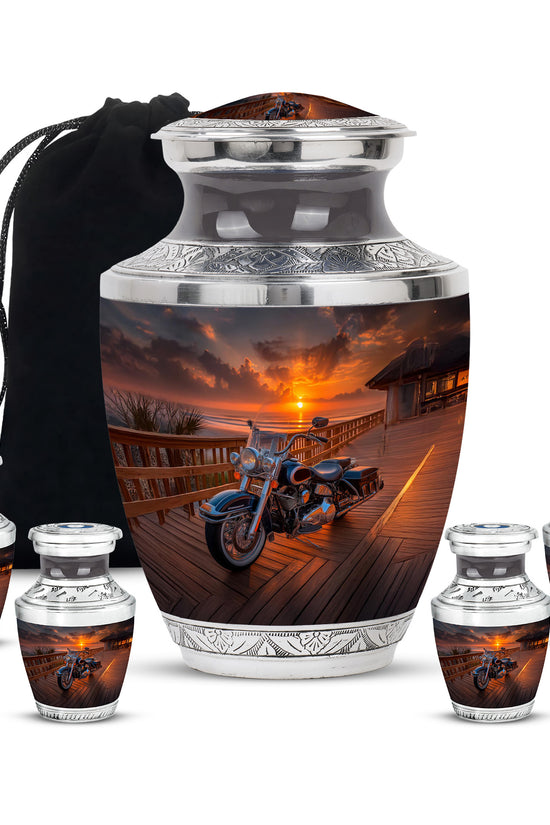 Midnight Black Bike Cremation Urn lifestyle display on memorial shelf - stylized abstract bike pattern with bold lines - memorial set with one large and four small urns