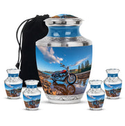 Pastel Blue Bike Cremation Urn lifestyle display on memorial shelf - contemporary bike design with modern artistic flair - memorial set with one large and four small urns