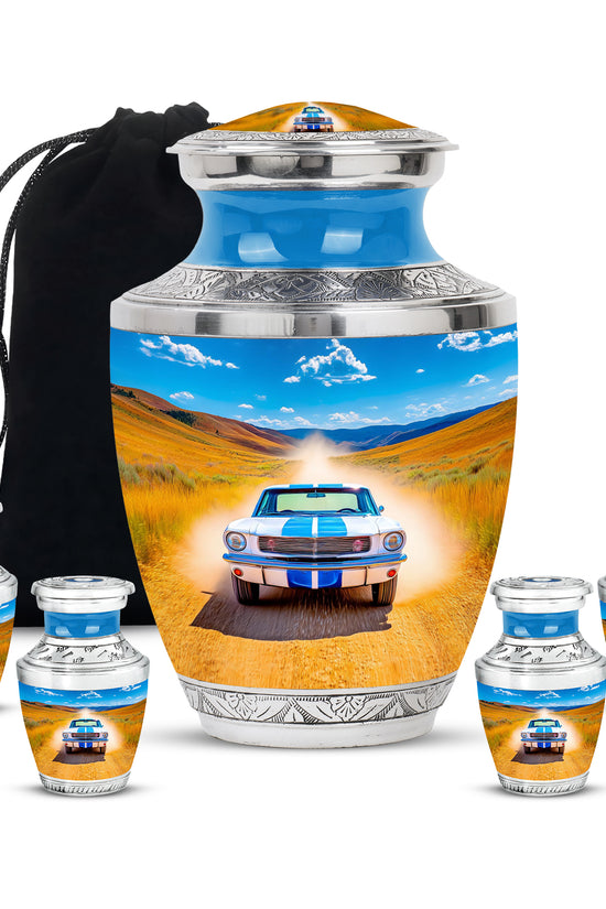 Soft Blue Car Cremation Urn lifestyle display on memorial shelf - stylized abstract car pattern with bold lines - memorial set with one large and four small urns