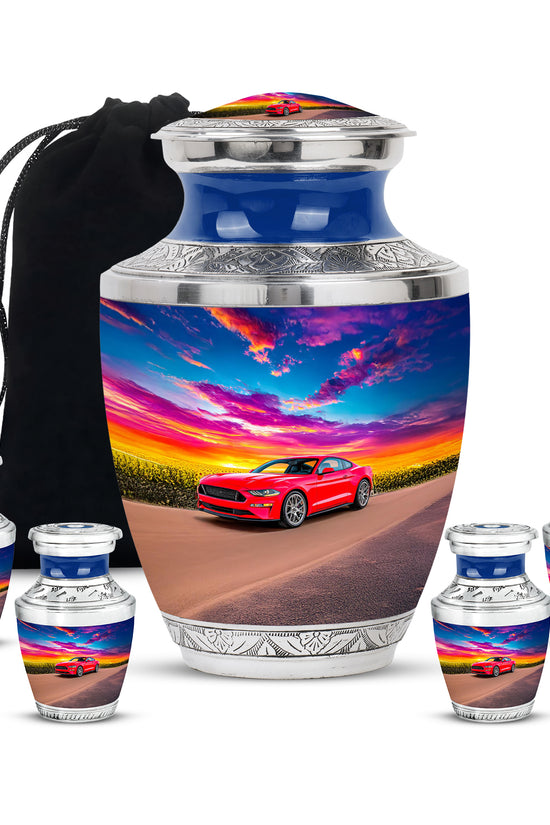 Royal Blue Car Cremation Urn lifestyle display on memorial shelf - stylized abstract car pattern with bold lines - memorial set with one large and four small urns