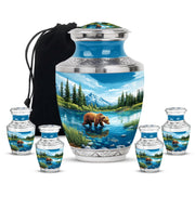 Soft Blue Bear Cremation Urn lifestyle display on memorial shelf - stylized abstract bear pattern with bold lines - memorial set with one large and four small urns