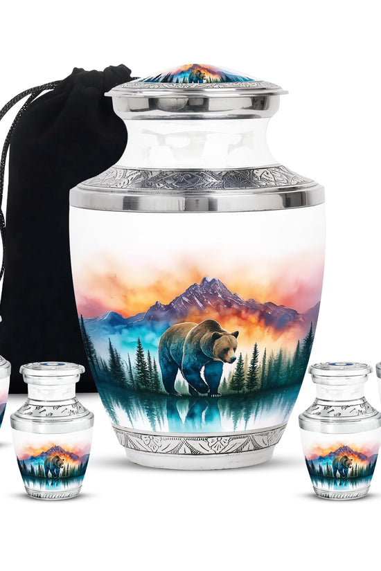 Antique Silver Bear Cremation Urn lifestyle display on memorial shelf - stylized abstract bear pattern with bold lines - memorial set with one large and four small urns