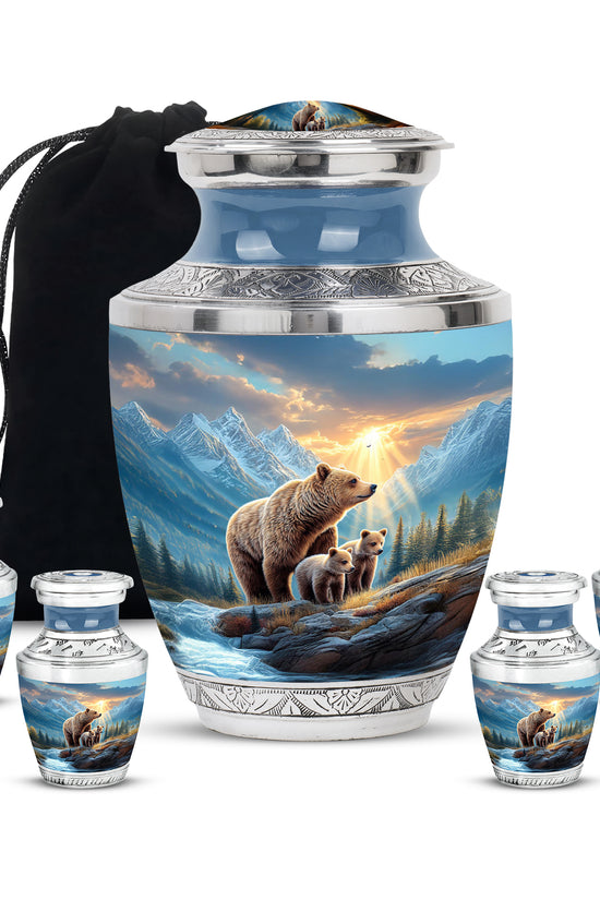 Powder Blue Bear Cremation Urn lifestyle display on memorial shelf - modern art-inspired bear motif on sleek aluminum - memorial set with one large and four small urns