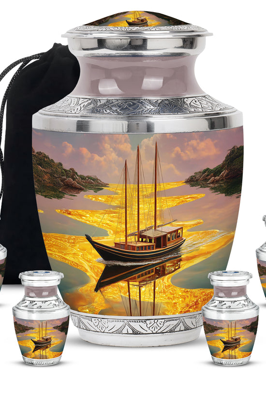 Burnished Gold Boat Cremation Urn lifestyle display on memorial shelf - stylized abstract boat pattern with bold lines - memorial set with one large and four small urns