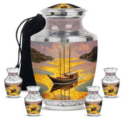 Burnished Gold Boat Cremation Urn lifestyle display on memorial shelf - stylized abstract boat pattern with bold lines - memorial set with one large and four small urns
