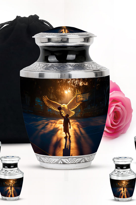 Ebony Basketball Cremation Urn lifestyle display on memorial shelf - modern art-inspired basketball motif on sleek aluminum - memorial set with one large and four small urns