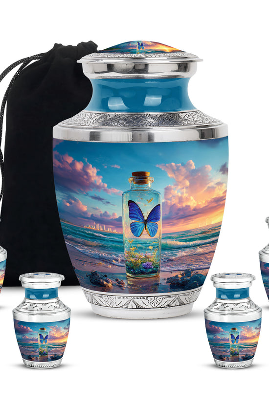 Slate Blue Butterfly Cremation Urn lifestyle display on memorial shelf - modern art-inspired butterfly motif on sleek aluminum - memorial set with one large and four small urns