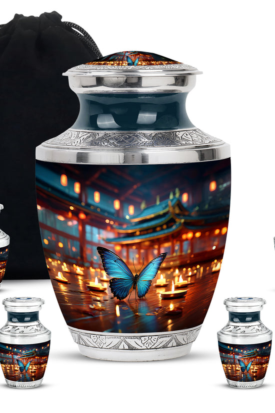 Steel Blue Butterfly Cremation Urn lifestyle display on memorial shelf - stylized abstract butterfly pattern with bold lines - memorial set with one large and four small urns