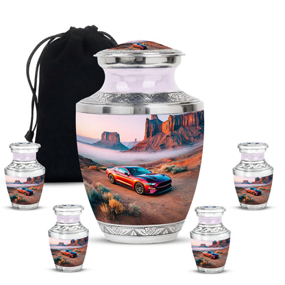 Polished Silver Car Cremation Urn lifestyle display on memorial shelf - stylized abstract car pattern with bold lines - memorial set with one large and four small urns