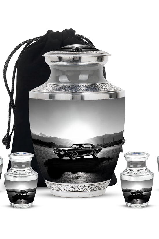 Pewter Gray Car Cremation Urn lifestyle display on memorial shelf - modern art-inspired car motif on sleek aluminum - memorial set with one large and four small urns