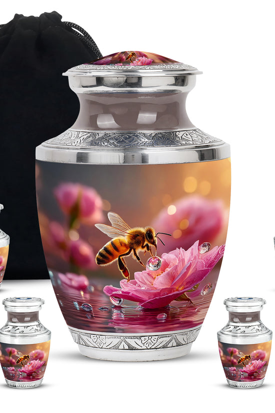 Gilded Gold Bee Cremation Urn lifestyle display on memorial shelf - contemporary bee design with modern artistic flair - memorial set with one large and four small urns