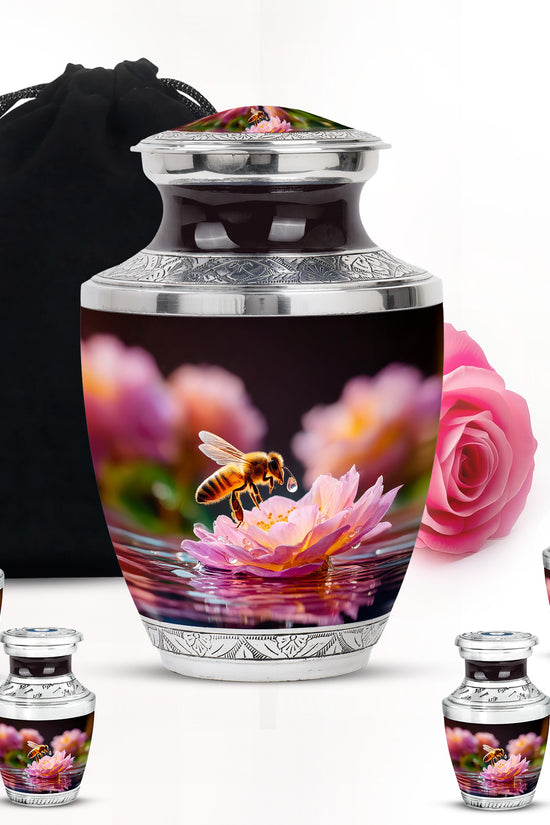 Glossy Black Bee Cremation Urn lifestyle display on memorial shelf - contemporary bee design with modern artistic flair - memorial set with one large and four small urns