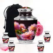 Glossy Black Bee Cremation Urn lifestyle display on memorial shelf - contemporary bee design with modern artistic flair - memorial set with one large and four small urns
