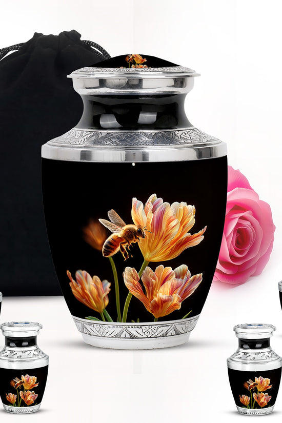 Dark Black Bee Cremation Urn lifestyle display on memorial shelf - stylized abstract bee pattern with bold lines - memorial set with one large and four small urns