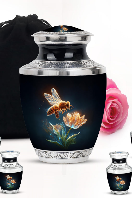 Jet Black Bee Cremation Urn lifestyle display on memorial shelf - modern art-inspired bee motif on sleek aluminum - memorial set with one large and four small urns