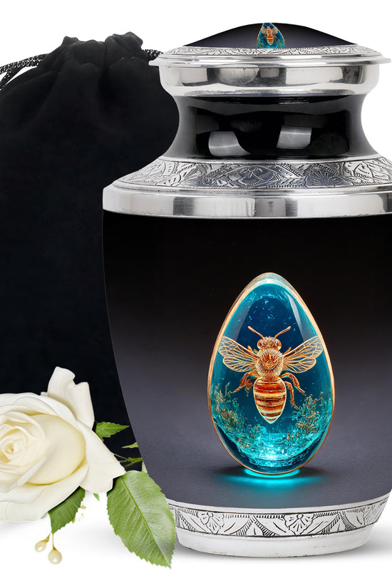 Charcoal Black Bee Cremation Urn side profile showing urn shape - stylized abstract bee pattern with bold lines - full-size 10 inch 200 cubic inch adult cremation urn