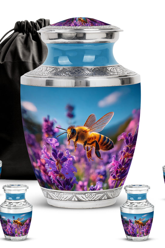 Twilight Blue Bee Cremation Urn lifestyle display on memorial shelf - stylized abstract bee pattern with bold lines - memorial set with one large and four small urns