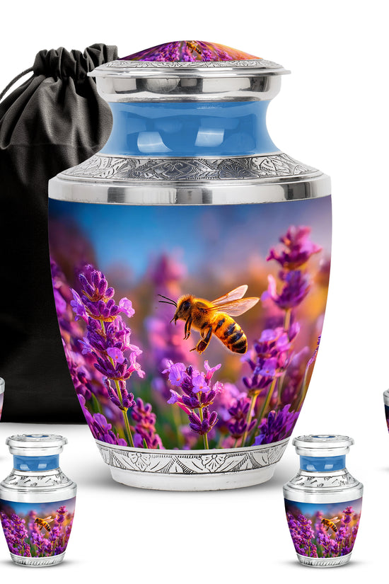 Indigo Bee Cremation Urn lifestyle display on memorial shelf - modern art-inspired bee motif on sleek aluminum - memorial set with one large and four small urns