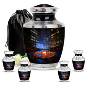 Deep Black Campfire Cremation Urn lifestyle display on memorial shelf - modern art-inspired campfire motif on sleek aluminum - memorial set with one large and four small urns