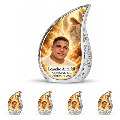 10 inch large Urn with 4 Keepsake 3 Inch Urns, Curved Drop guardian angel memorial urn with amber cloudlight and Leandro Aurelfell photo and dates.