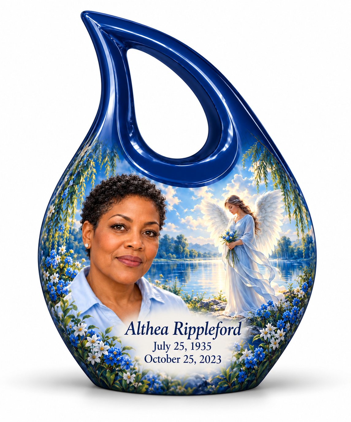 1 Keepsake 3 inch Urn, Cross Drop angel beside quiet blue water memorial urn and Althea Rippleford photo and dates.