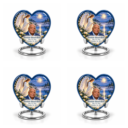 4 Keepsake 3 inch Urns, Heart angel beside quiet blue water memorial urn and Bastian Shorewillow photo and dates.