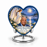 1 Keepsake 3 inch Urn, Heart angel beside quiet blue water memorial urn and Bastian Shorewillow photo and dates.