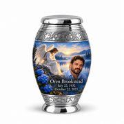 1 Keepsake 3 inch Urn, Monar angel beside quiet blue water memorial urn and Oren Brookstead photo and dates.