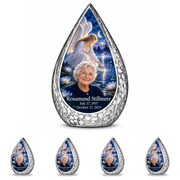 10 inch large Urn with 4 Keepsake 3 Inch Urns Straight Drop memorial urn, angel beside quiet blue water, Rosamund Stillmere portrait and full memorial dates, white background.