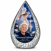 10 inch large Urn Straight Drop memorial urn, angel beside quiet blue water, Rosamund Stillmere portrait and full memorial dates, white background.