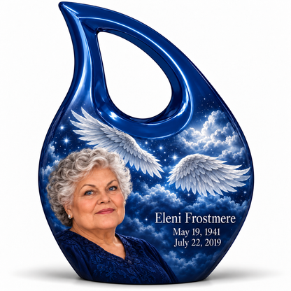 1 Keepsake 3 inch Urn, Cross Drop memorial urn with silver angel wings, sapphire night and Eleni Frostmere portrait.