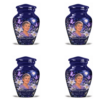 4 Keepsake 3 inch Urns, Classic urn with purple butterflies and moonlit white lilies, Brenna Quillford portrait, January 21, 1951 to August 5, 2023.