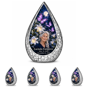 10 inch large Urn with 4 Keepsake 3 Inch Urns, Straight Drop urn with purple butterflies and moonlit white lilies, Lucinda Fairgrove portrait, May 31, 1944 to December 8, 2019.