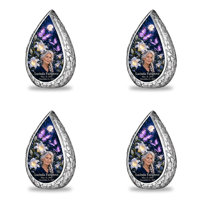 4 Keepsake 3 inch Urns, Straight Drop urn with purple butterflies and moonlit white lilies, Lucinda Fairgrove portrait, May 31, 1944 to December 8, 2019.