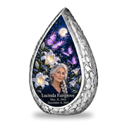 1 Keepsake 3 inch Urn, Straight Drop urn with purple butterflies and moonlit white lilies, Lucinda Fairgrove portrait, May 31, 1944 to December 8, 2019.