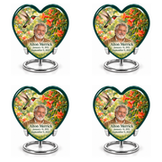 Hummingbird 01 set of four identical Heart keepsakes in two rows, each with a hovering ruby-throated bird, orange trumpet vine, fictional Alton Merrick portrait and full dates on silver ring stands.