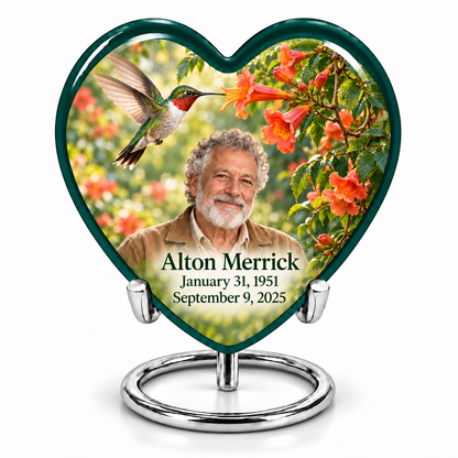 Hummingbird 01 single Heart keepsake with a ruby-throated bird at coral-orange trumpet flowers, fictional Alton Merrick portrait and full dates, without quote, on a complete silver ring stand.