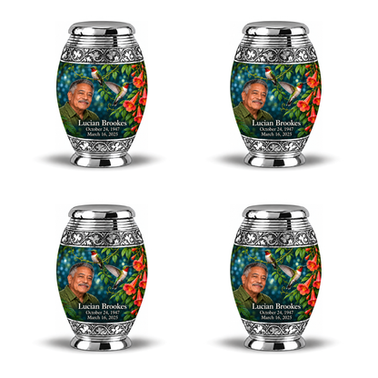 Four identical 3-inch keepsakes, Monar ruby-throated hummingbird and coral trumpet-vine design with fictional Lucian Brookes portrait, name and full memorial dates on white background.