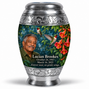 One 10-inch large urn, Monar ruby-throated hummingbird and coral trumpet-vine design with fictional Lucian Brookes portrait, name and full memorial dates on white background.