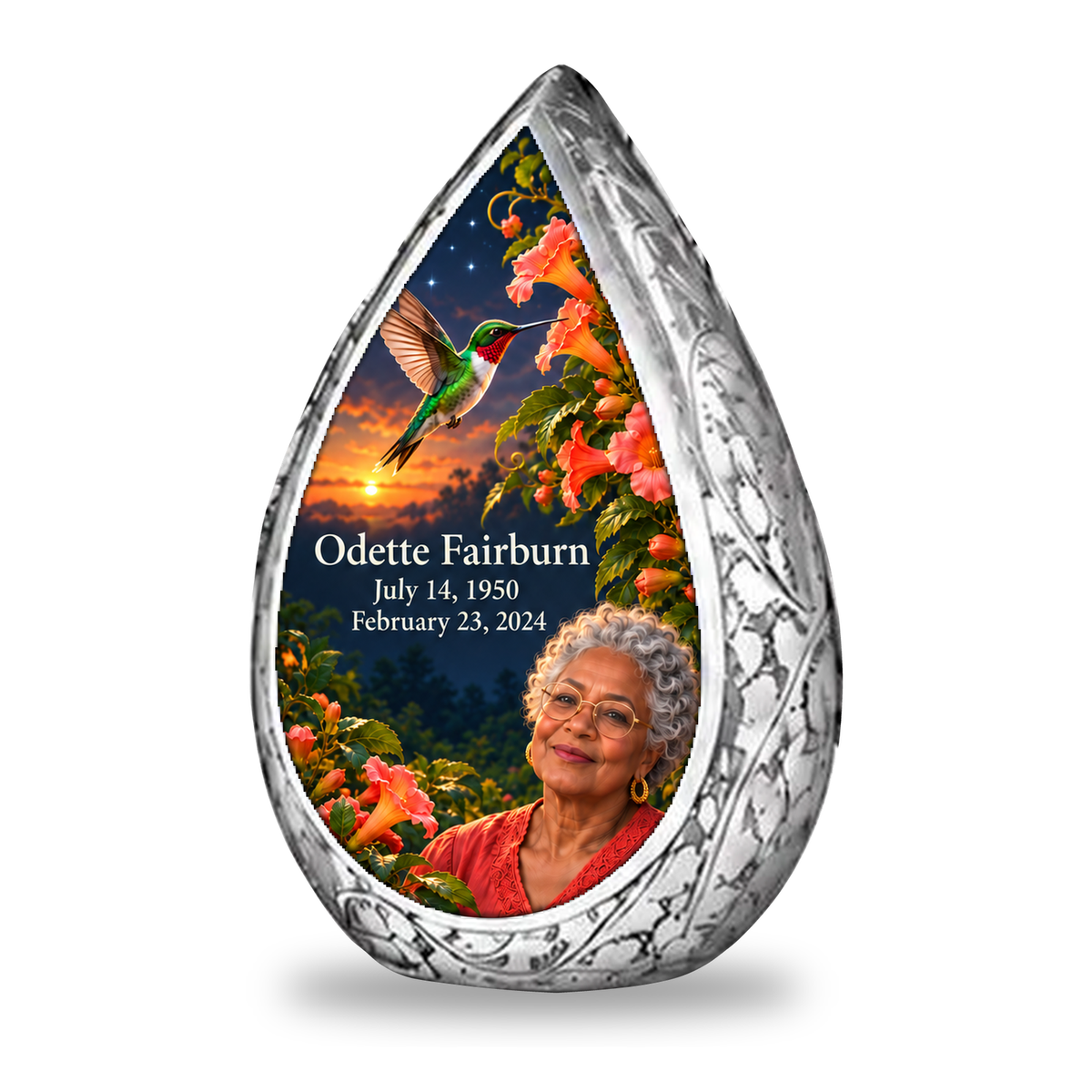 Hummingbird 01 Straight Drop, 1 Keepsake 3 inch Urn: original engraved silver frame surrounding a ruby-throated hummingbird, peach-coral trumpet vine and apricot-to-navy dusk; fictional Odette Fairburn portrait, name and full dates.