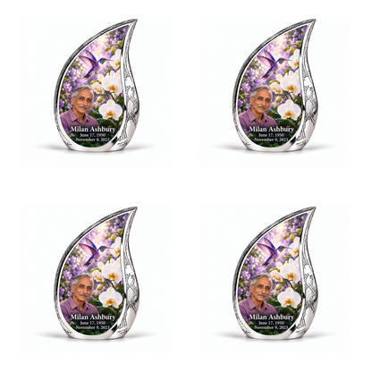 Hummingbird 02 Curved Drop, four identical keepsakes: violet hummingbird above white orchids and lilac garden inside a complete engraved silver frame; Milan Ashbury portrait, name and full dates.