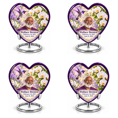 Hummingbird 02 Heart, four identical keepsakes: purple-bordered heart with violet hummingbird, white orchids and Wallace Brenton portrait, name and full dates, on four complete silver ring stands.