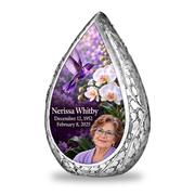 Single silver Straight Drop keepsake with violet hummingbird, white orchids, lavender garden backdrop and Nerissa Whitby portrait, name and full dates.
