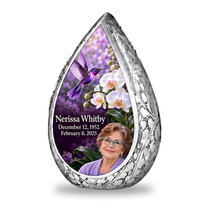 Single silver Straight Drop keepsake with violet hummingbird, white orchids, lavender garden backdrop and Nerissa Whitby portrait, name and full dates.