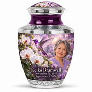 One 10-inch Tasty large urn with silver engraved trim, domed violet hummingbird and white orchid lid, solid purple neck and fictional Keiko Bramwell portrait with full dates.